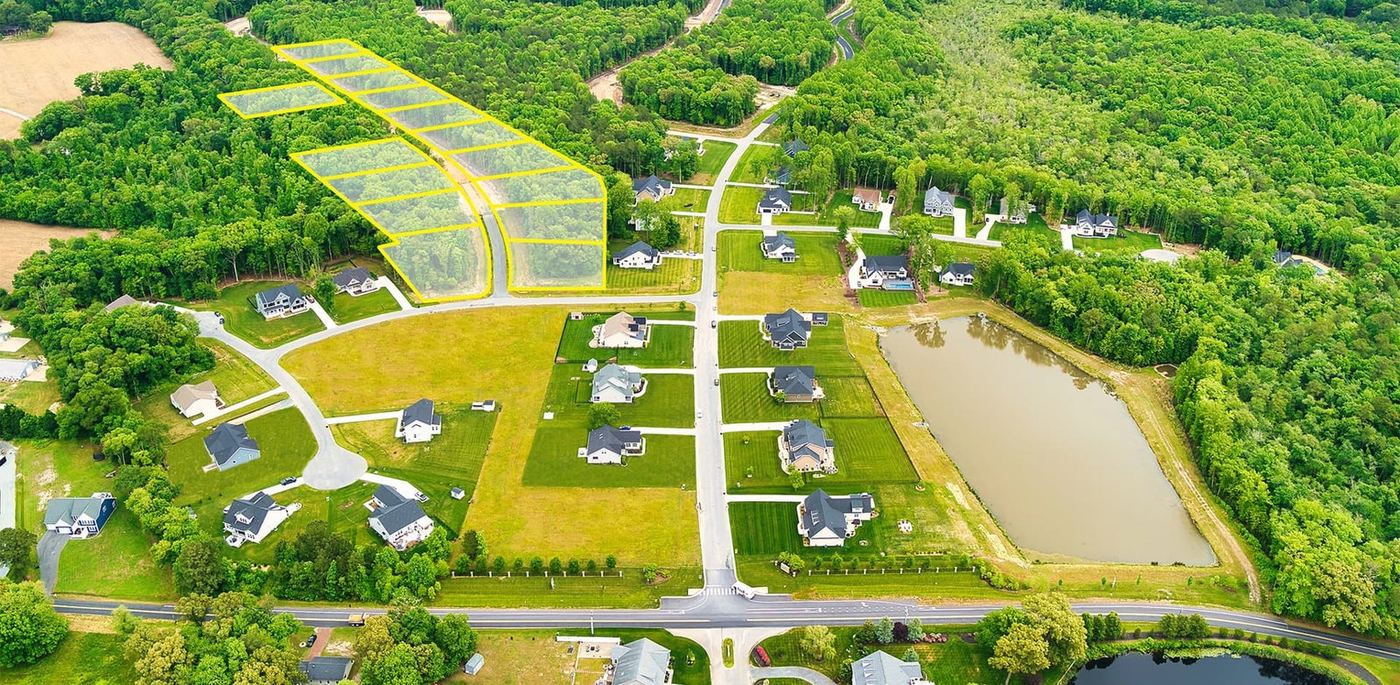 Aerial view of Ingrams Point homesites, woods and pond
